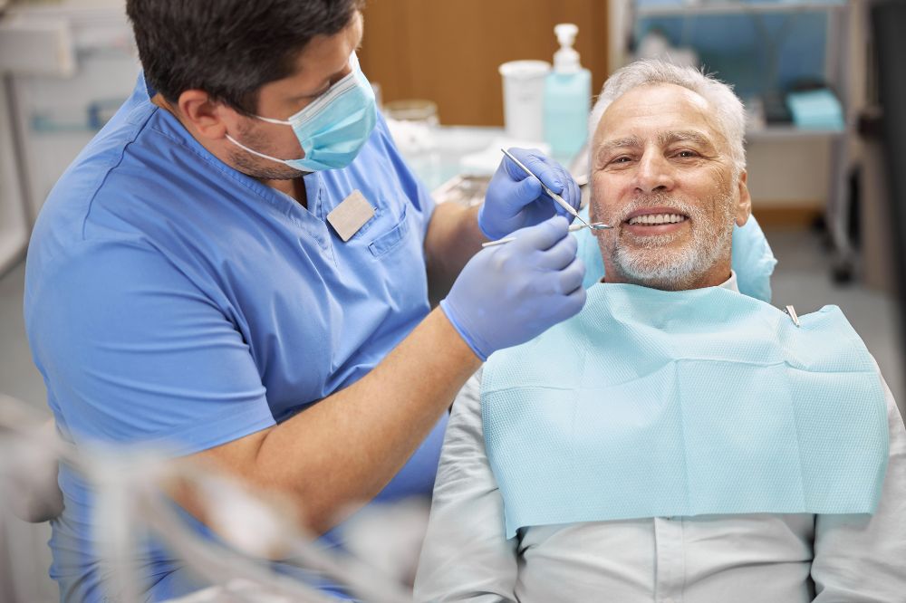 Senior Patient Having A Dental Treatment At The Cl PNLCQZ3